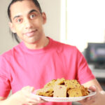 Image of Atlas holding a plate of chop chip shortbread cookies.